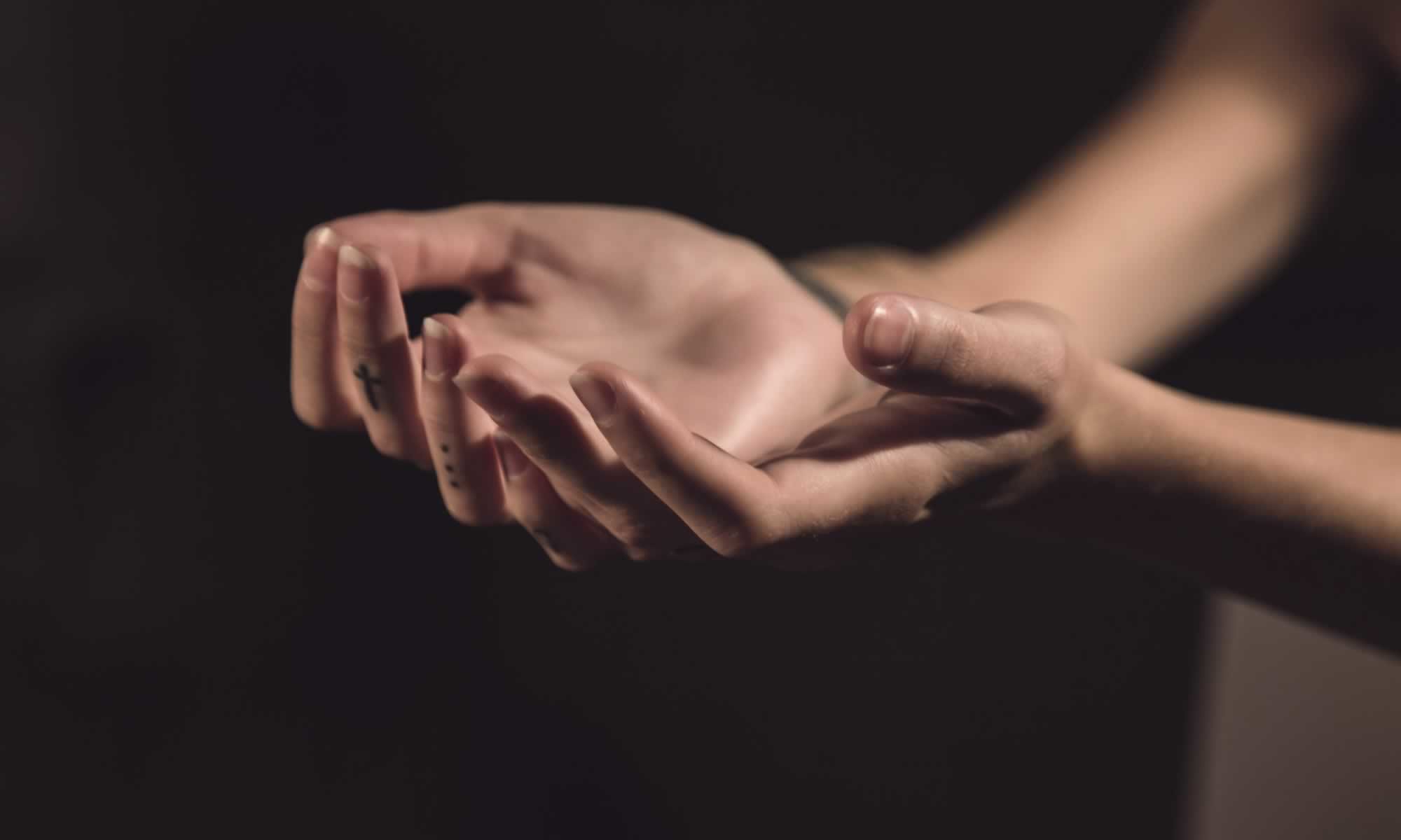 Cupped hands reaching out